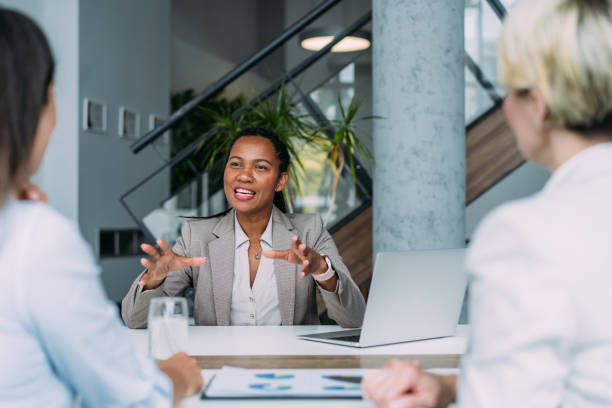 Executive team conducting meeting in modern conference room